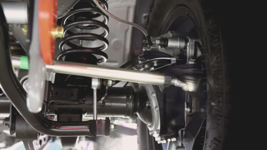 Close view of a car wheel and suspension components