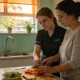 Support worker and a resident talking in the living room of a bright supported-living home